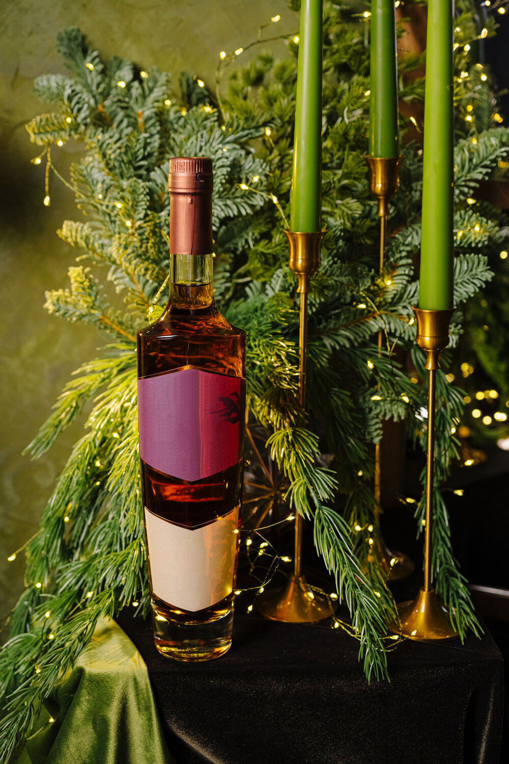 Festively decorated bottle by candlelight